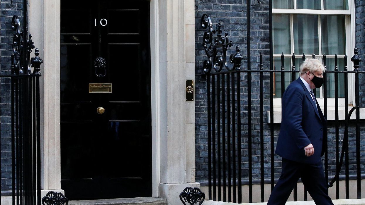 British Prime Minister Boris Johnson walks outside Downing Street in London, Britain, January 12, 2022.