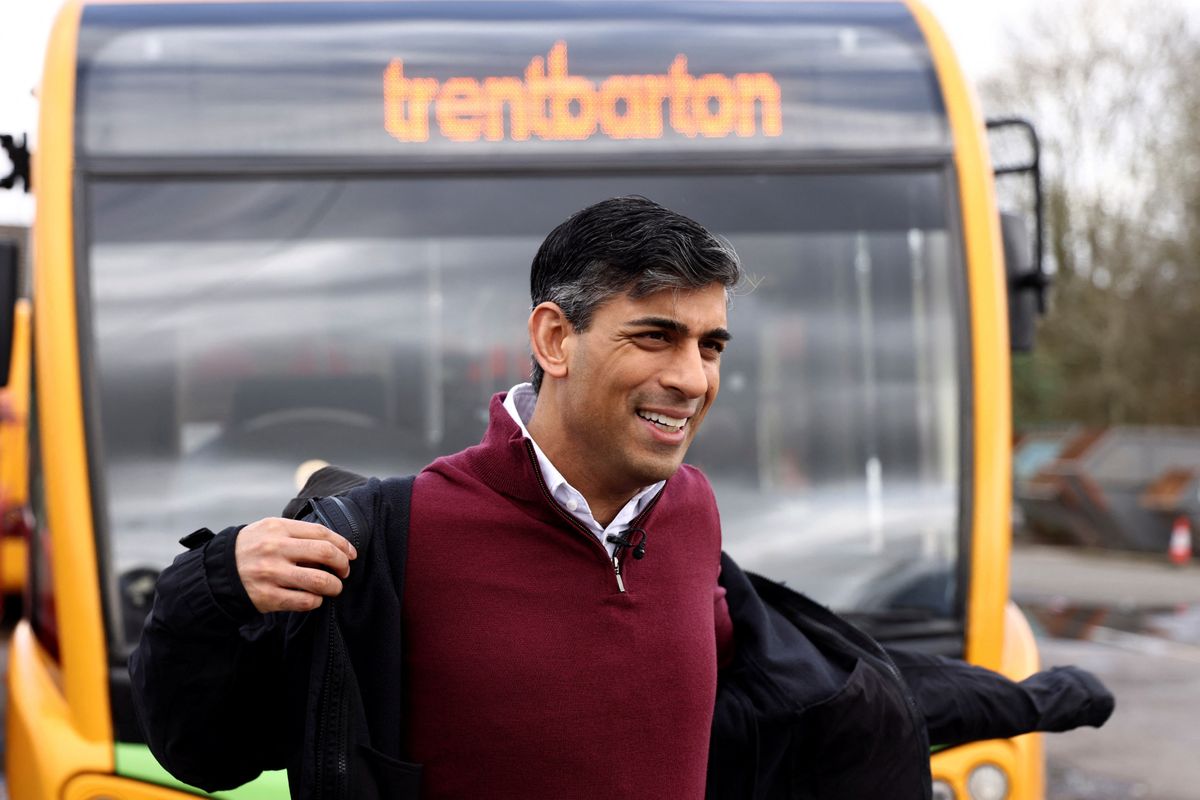 British Prime Minister Rishi Sunak prepares to speak to employees of a bus depot during the launch of the local election campaign in Heanor, Britain, March 22, 2024. 
