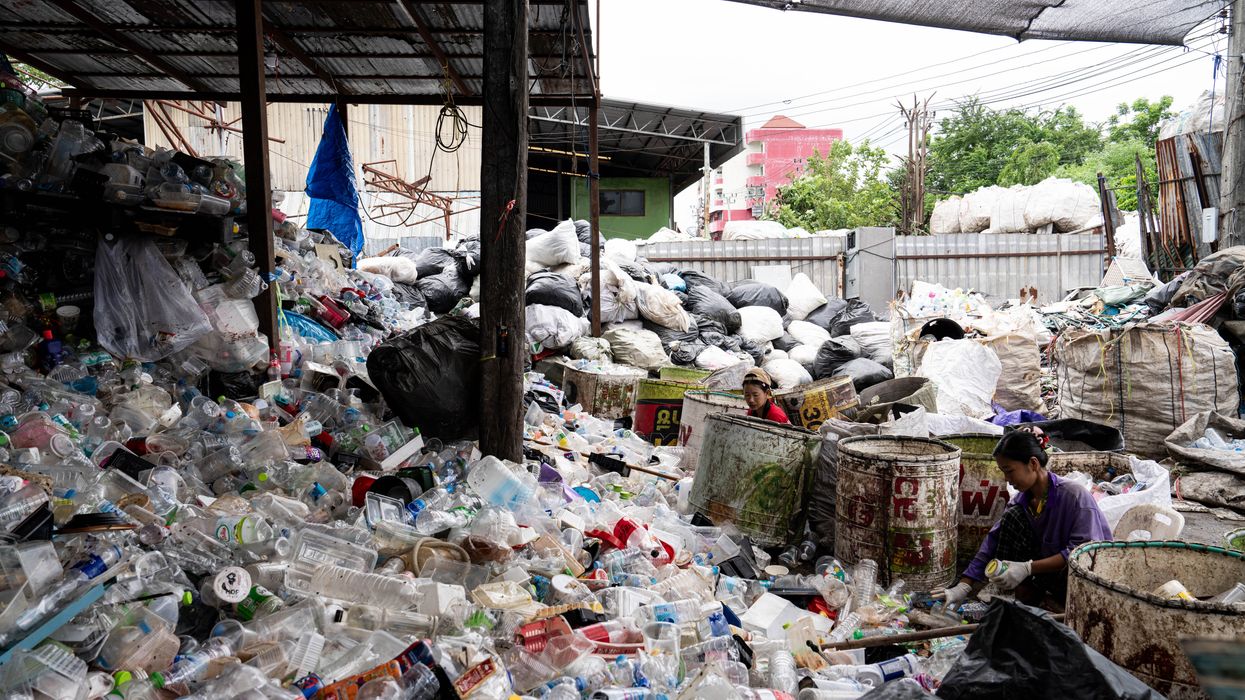 Burmese workers are sorting rotting food waste, fabric, and recyclable plastic by hand at a sorting facility in Bangkok, Thailand, on July 22, 2024.