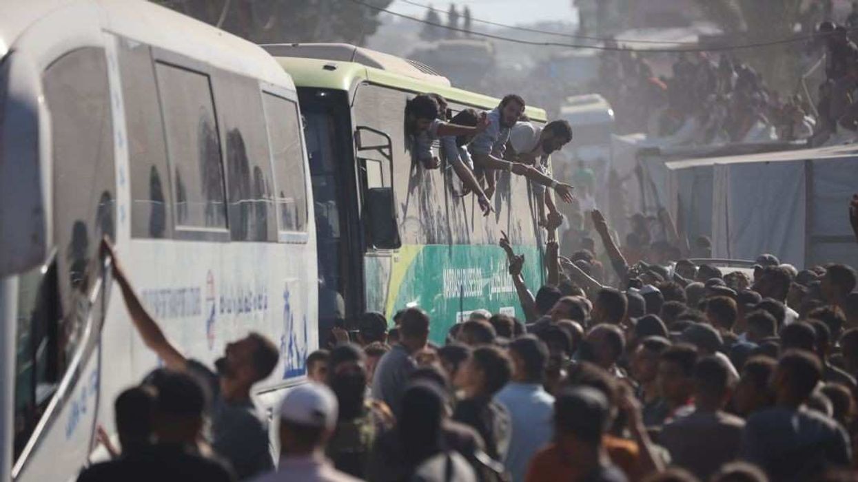 Buses carrying Palestinians released from Israeli prisons under a Gaza ceasefire and hostage exchange deal with Palestinian factions arrive outside the Nasser hospital in Khan Yunis, Gaza Strip, on October 13, 2025.
