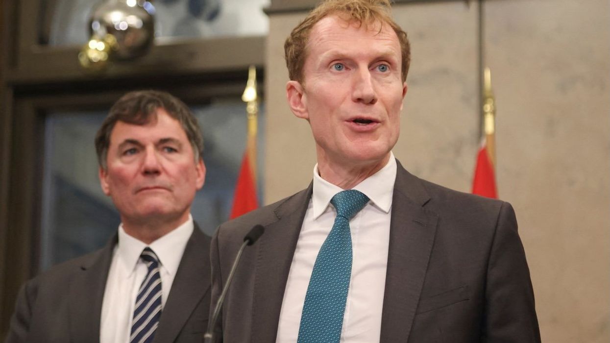 Canada's Minister of Immigration, Refugees and Citizenship Marc Miller speaks at a press conference about the government's border plan as Public Safety and Finance Minister Dominic LeBlanc listens, on Parliament Hill in Ottawa, Ontario, on Dec. 17, 2024.