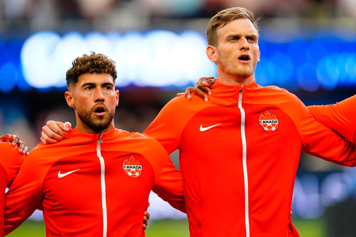 Canada's Scott Kennedy and Jonathan Osorio stand during the playing of the national anthem before the CONCACAF Nations League match against USMNT at the Allegiant Stadium in Las Vegas, Nevada.