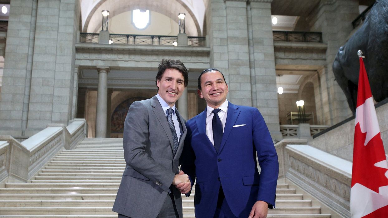 Canada’s Prime Minister Justin Trudeau and Manitoba Premier Wab Kinew shake hands as they meet at the Manitoba Legislative Building in Winnipeg, Manitoba, Canada February 15, 2024.
