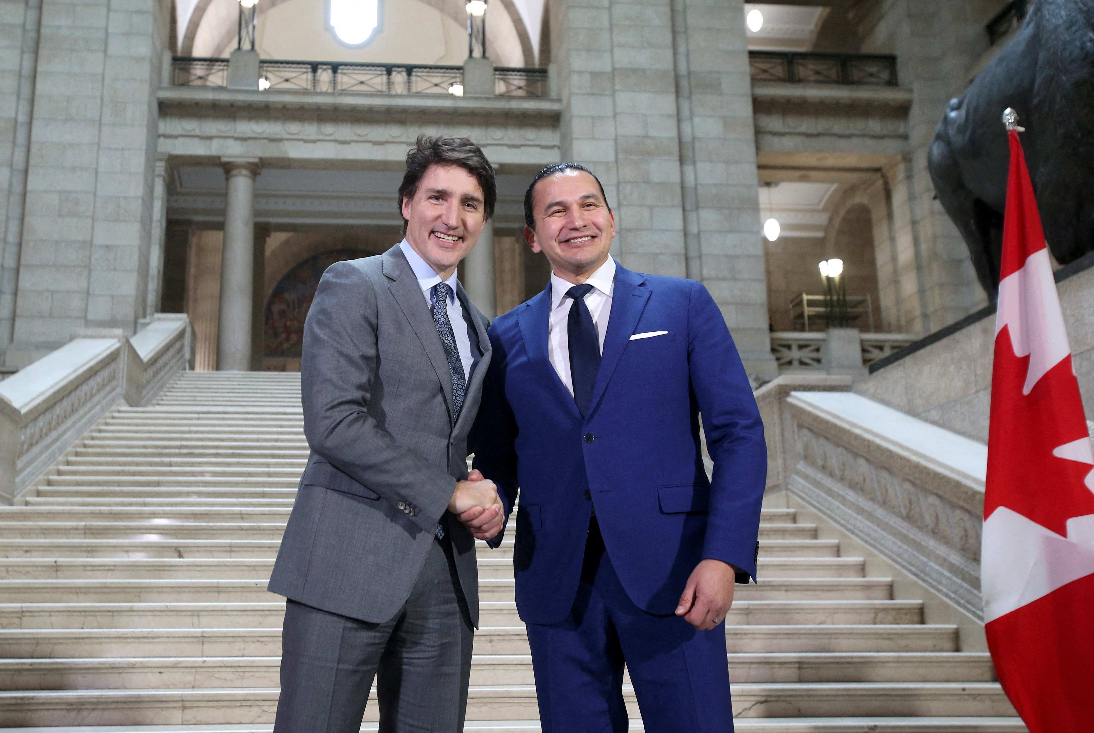 Canada’s Prime Minister Justin Trudeau and Manitoba Premier Wab Kinew shake hands as they meet at the Manitoba Legislative Building in Winnipeg, Manitoba, Canada February 15, 2024.
