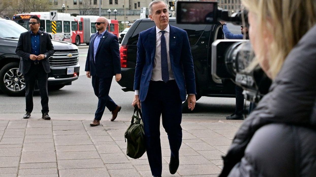 Canada’s Prime Minister Mark Carney walks back his office in Ottawa, Ontario, Canada, on April 29, 2025.