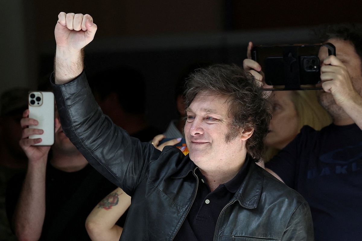 ​Candidate Javier Milei greets his supporters as he arrives at the school where he votes, in Buenos Aires, Argentina, on Nov. 19, 2023. 