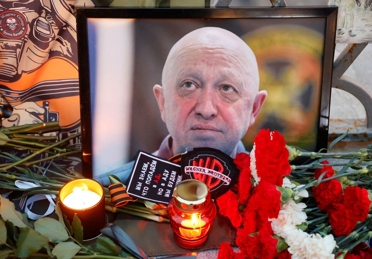 Candles are placed at a makeshift memorial near the former PMC Wagner Center, associated with the founder of the Wagner Group and Yevgeny Prigozhin, in St. Petersburg, Russia. 