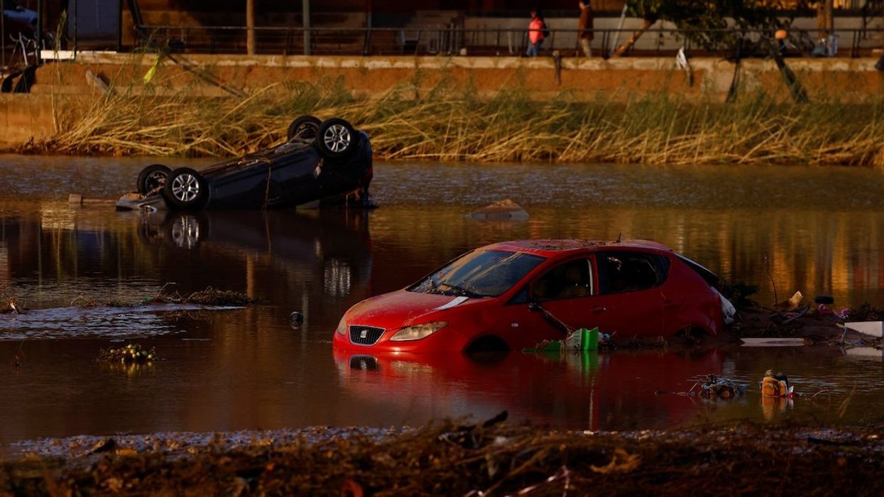 Cars lie partially submerged after floods in Utiel, Spain, on Oct. 30, 2024.