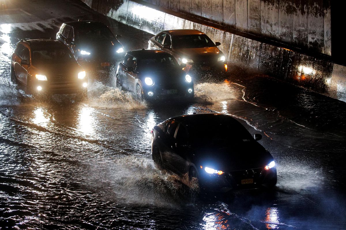 Cars navigate a flooded highway, as local media reported the remnants of Tropical Storm Ida bringing drenching rain and the threat of flash floods and tornadoes to parts of the northern mid-Atlantic, in the Queens borough of New York City, U.S., September 2, 2021.