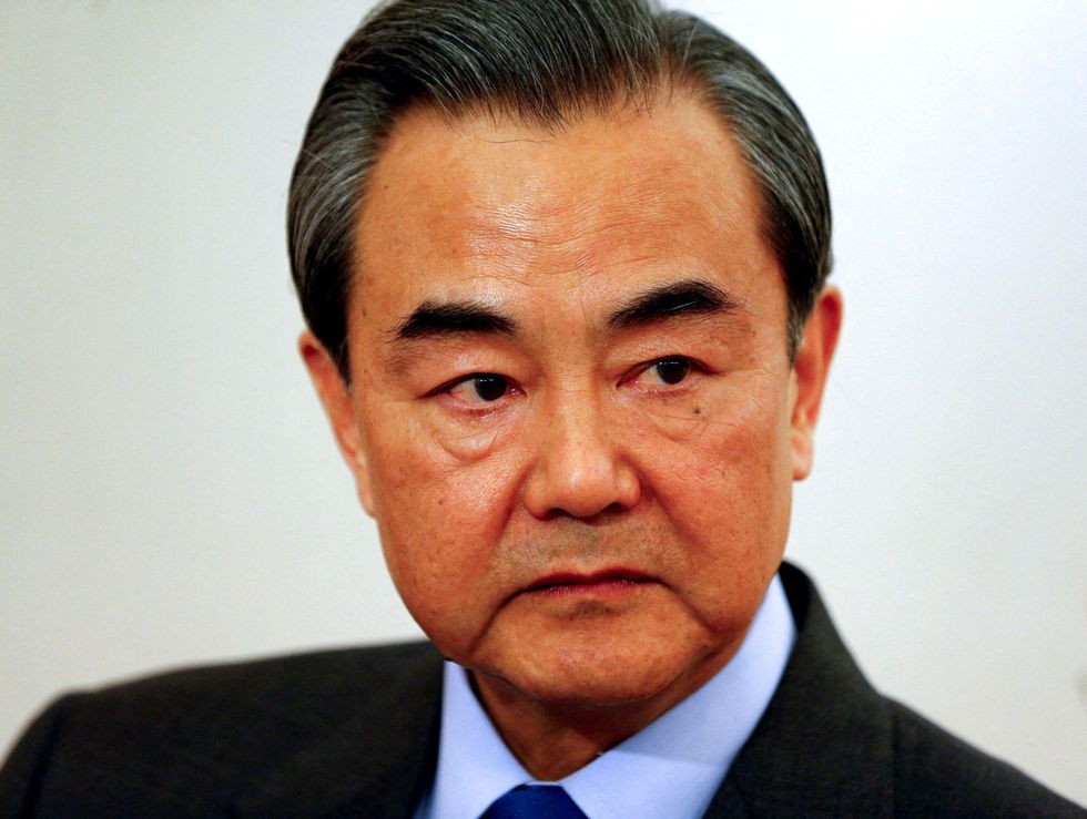 China's Foreign Minister Wang Yi answers questions during a Reuters interview in Munich, Germany.