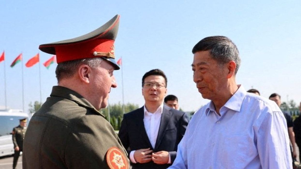 Chinese Defence Minister Li Shangfu is welcomed by Belarusian Defence Minister Viktor Khrenin