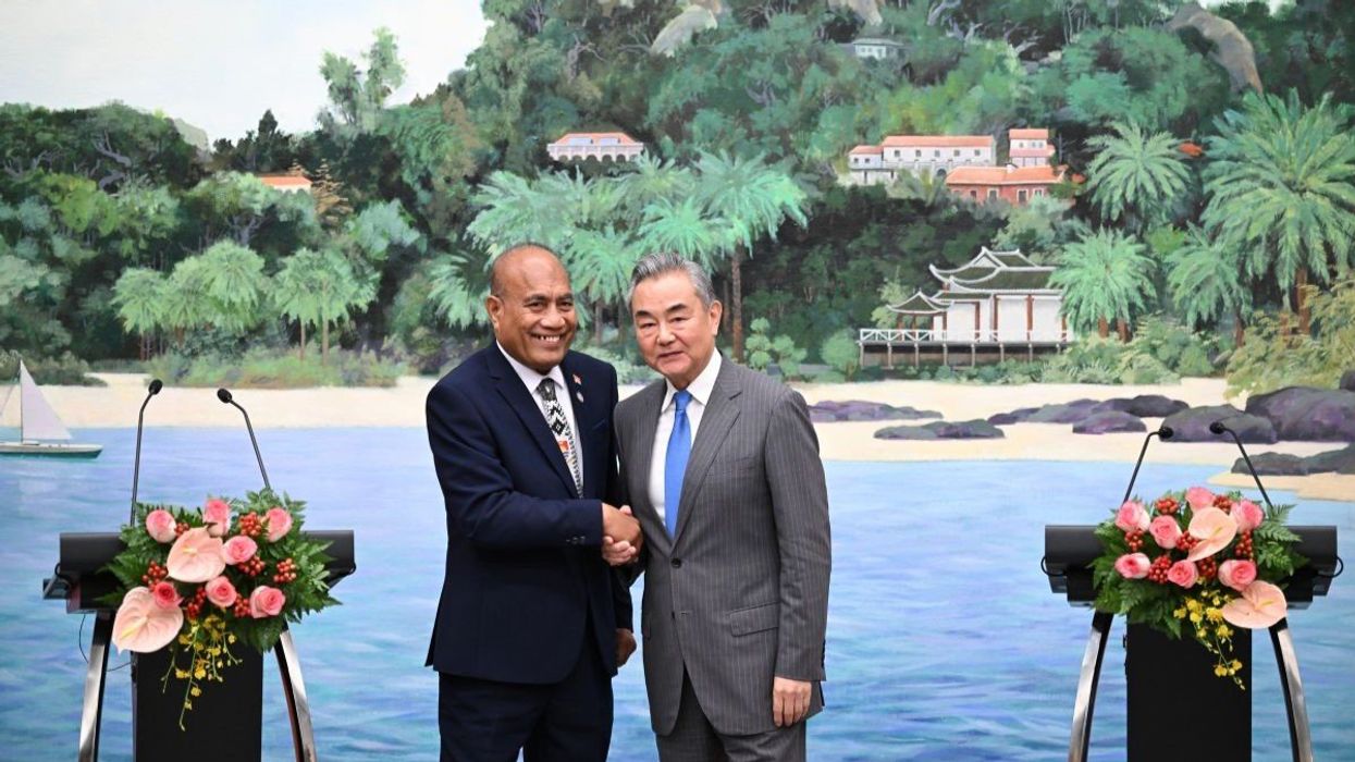 Chinese Foreign Minister Wang Yi and Kiribati's President and Foreign Minister Taneti Maamau meet after the Third China-Pacific Island Countries Foreign Ministers' Meeting in Xiamen, China.