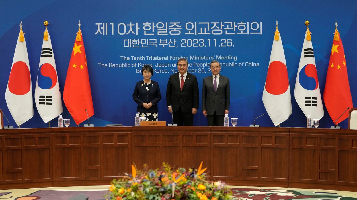 Chinese Foreign Minister Wang Yi, South Korean Foreign Minister Park Jin, and Japanese Foreign Minister Yoko Kamikawa pose for a photo prior to the 10th trilateral foreign ministers' meeting in Busan, South Korea, Sunday, Nov. 26, 2023.