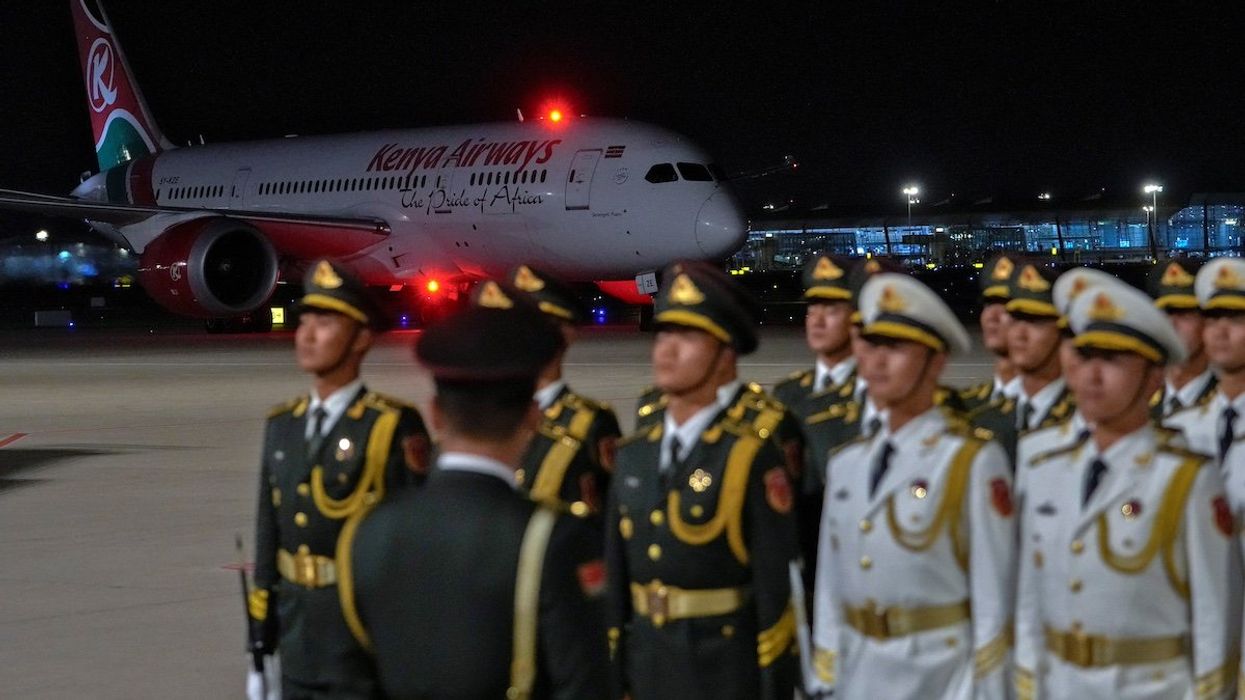 Chinese honor guard stand in formation as the plane carrying Kenya's President William Ruto arrives at the VIP terminal of the Beijing Capital International Airport in Beijing, China, September 2, 2024, ahead of the China Africa Forum.