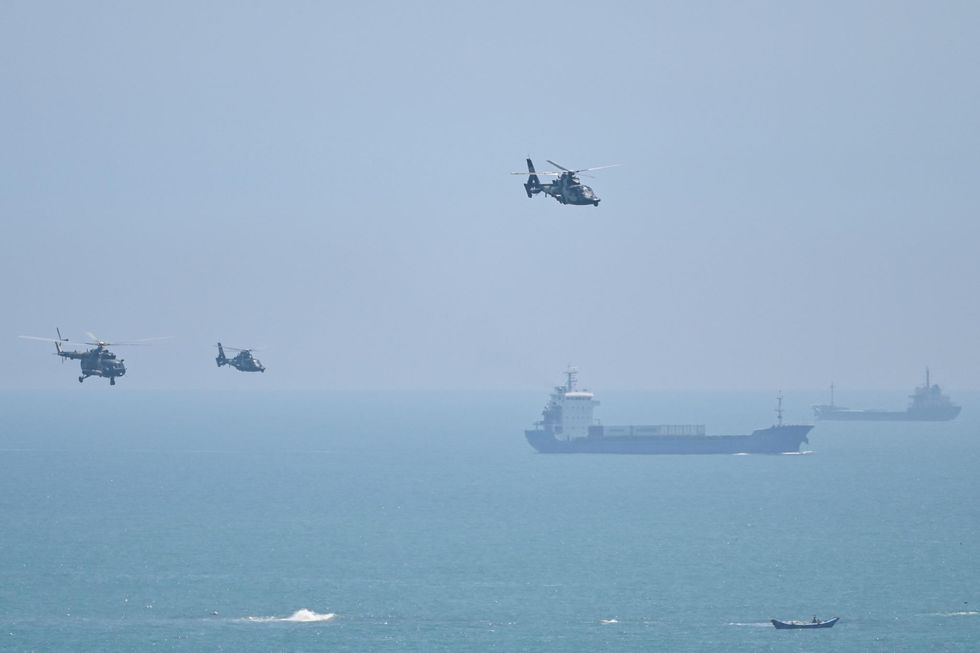 Chinese military helicopters perform drills near Taiwan. 