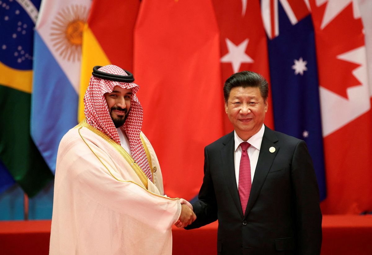 Chinese President Xi Jinping shakes hands with Saudi Arabia's Crown Prince Mohammed bin Salman 