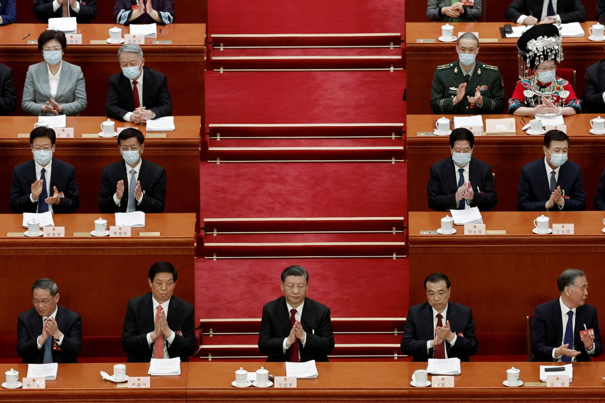 Chinese President Xi Jinping surrounded by other members of the Chinese government at the Great Hall of the People in Beijing, China March 5, 2023.