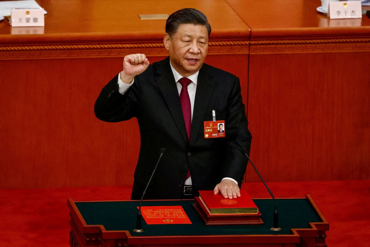 Chinese President Xi Jinping takes his oath during the National People's Congress at the Great Hall of the People, in Beijing.