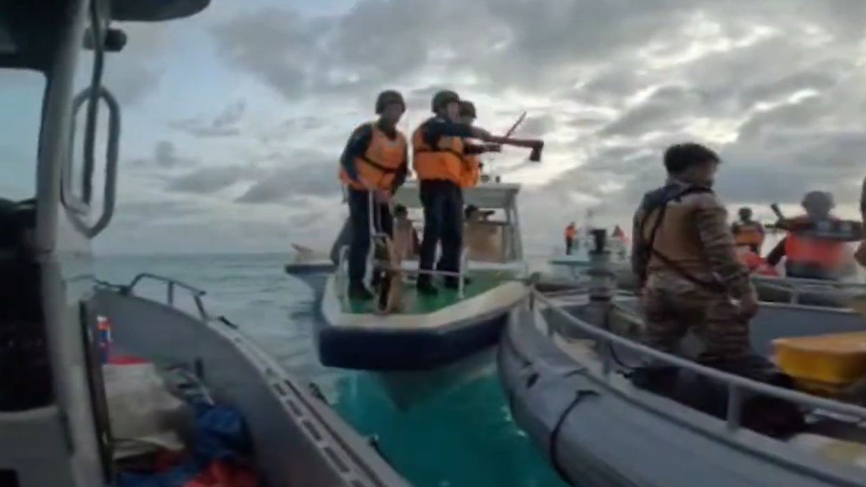 Chinese sailors armed with axes and machetes threaten Filipino sailors on a supply run, 17 June, 2024.