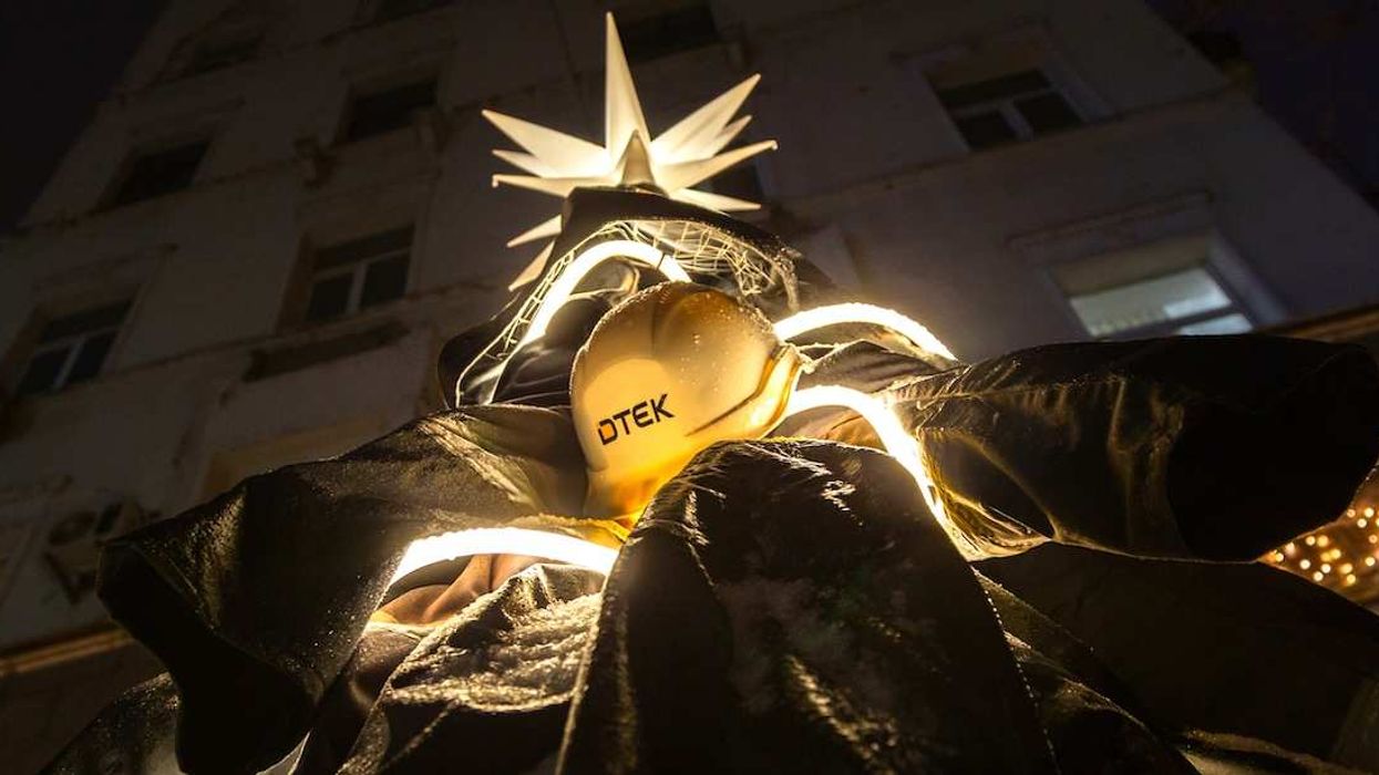 Christmas tree made of the uniforms of electricity grid workers.