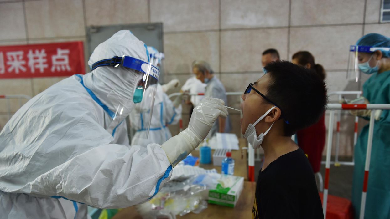 Citizens line up for COVID-19 nucleic acid test at a testing site in Yuhuatai District of Nanjing City, east China's Jiangsu Province, 2 August 2021. Nanjing City launches the fourth round of Covid-19 test.