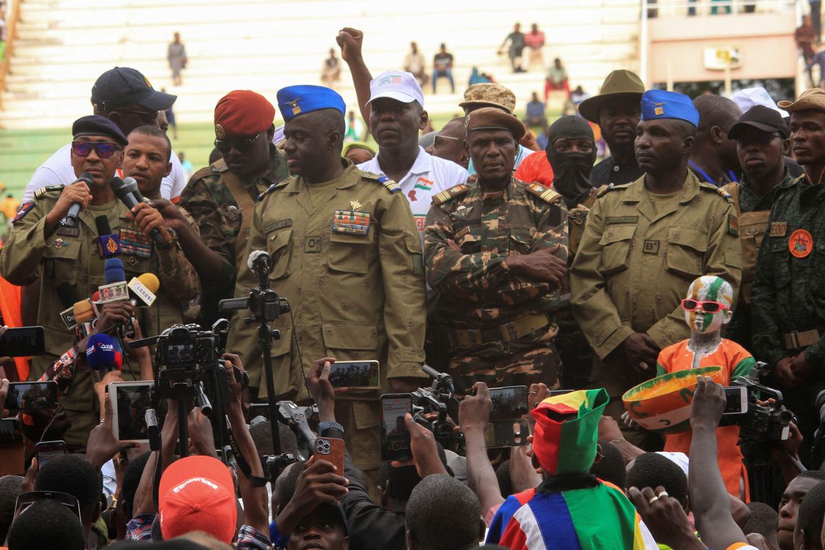 Colonel Sidi Mohamed delivers a message as he stands with other Nigerien junta leaders. 