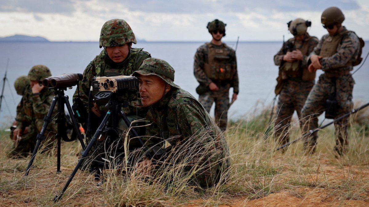 ​Commander Shingo Nashinoki, 50, and soldiers of the Japanese Ground Self-Defense Force's Amphibious Rapid Deployment Brigade (ARDB), Japan's first marine unit since World War Two, take part in a military drill as U.S. Marines observe, on the uninhabited Irisuna island close to Okinawa, Japan, November 15, 2023.