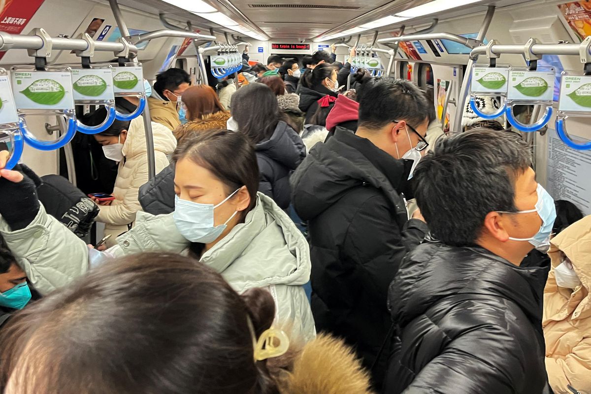 Commuters ride a subway train during the morning rush hour in Beijing. 