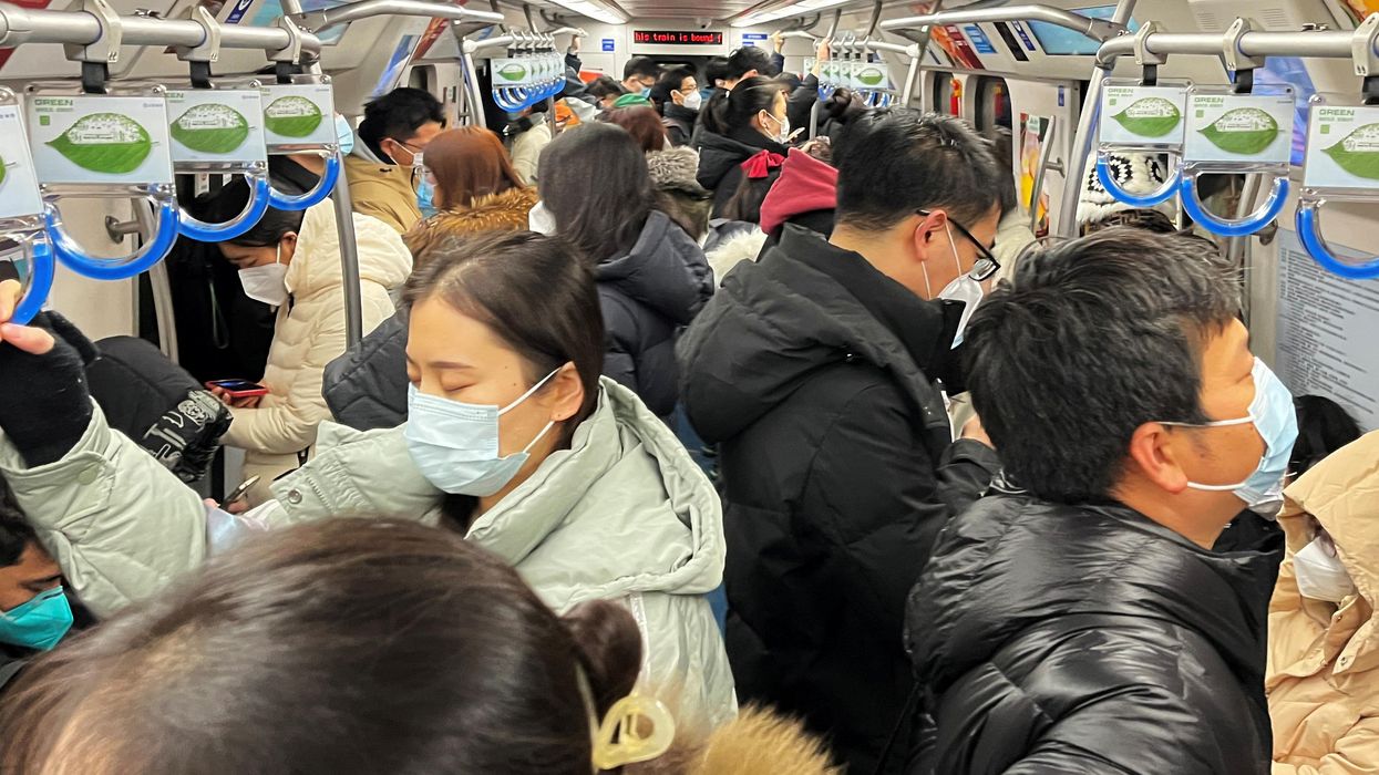 Commuters ride a subway train during the morning rush hour in Beijing.