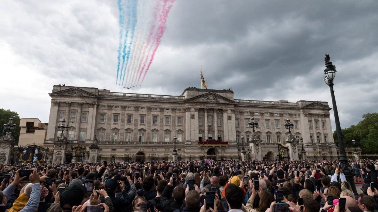 Crowds gather outside Buckingham Palace to celebrate VE Day in London, United Kingdom, on May 05, 2025.
