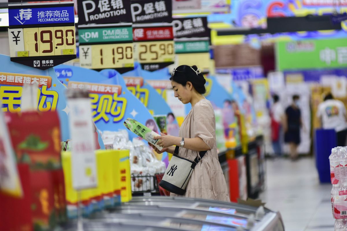 Customers shop at a supermarket in Qingzhou, Shandong province, China.