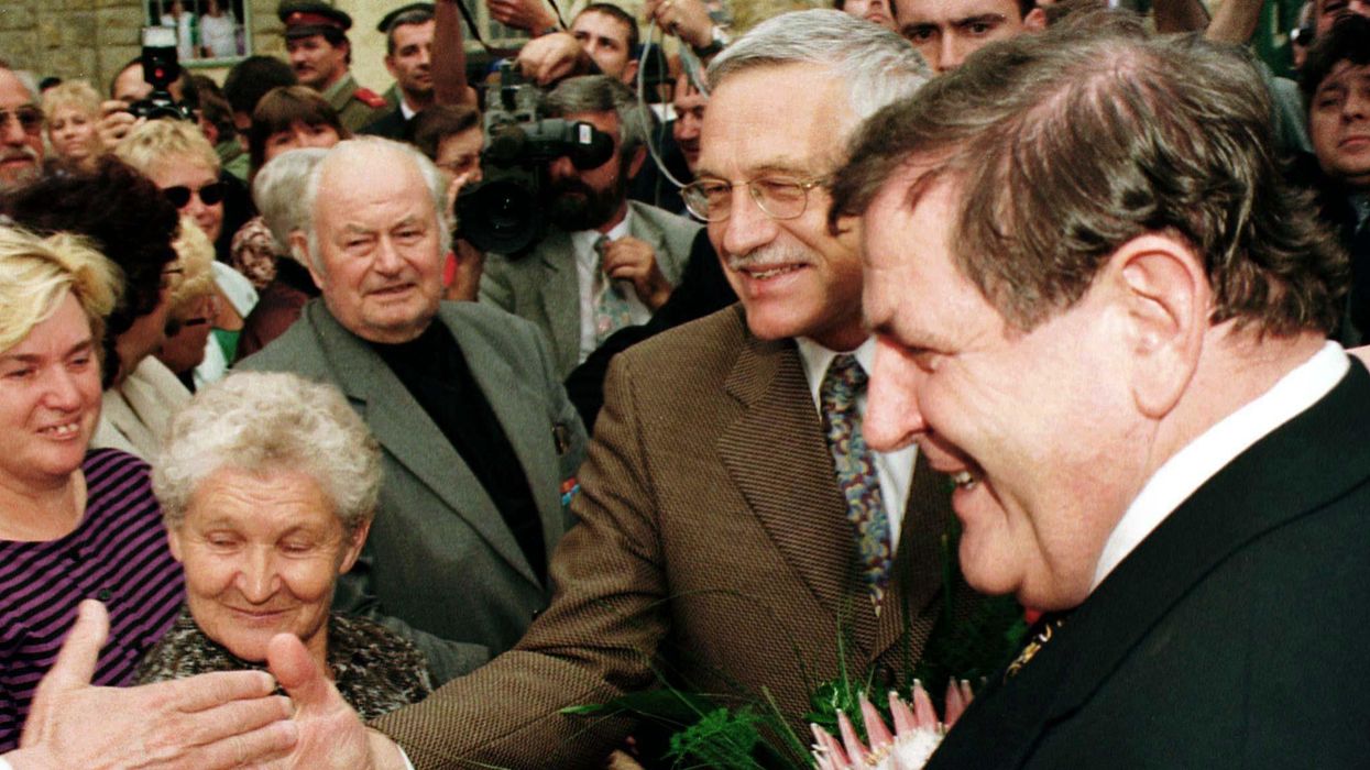 Czech Prime Minister Vaclav Klaus and his Slovak counterpart Vladimir Meciar greeted by a crowd in 1993.