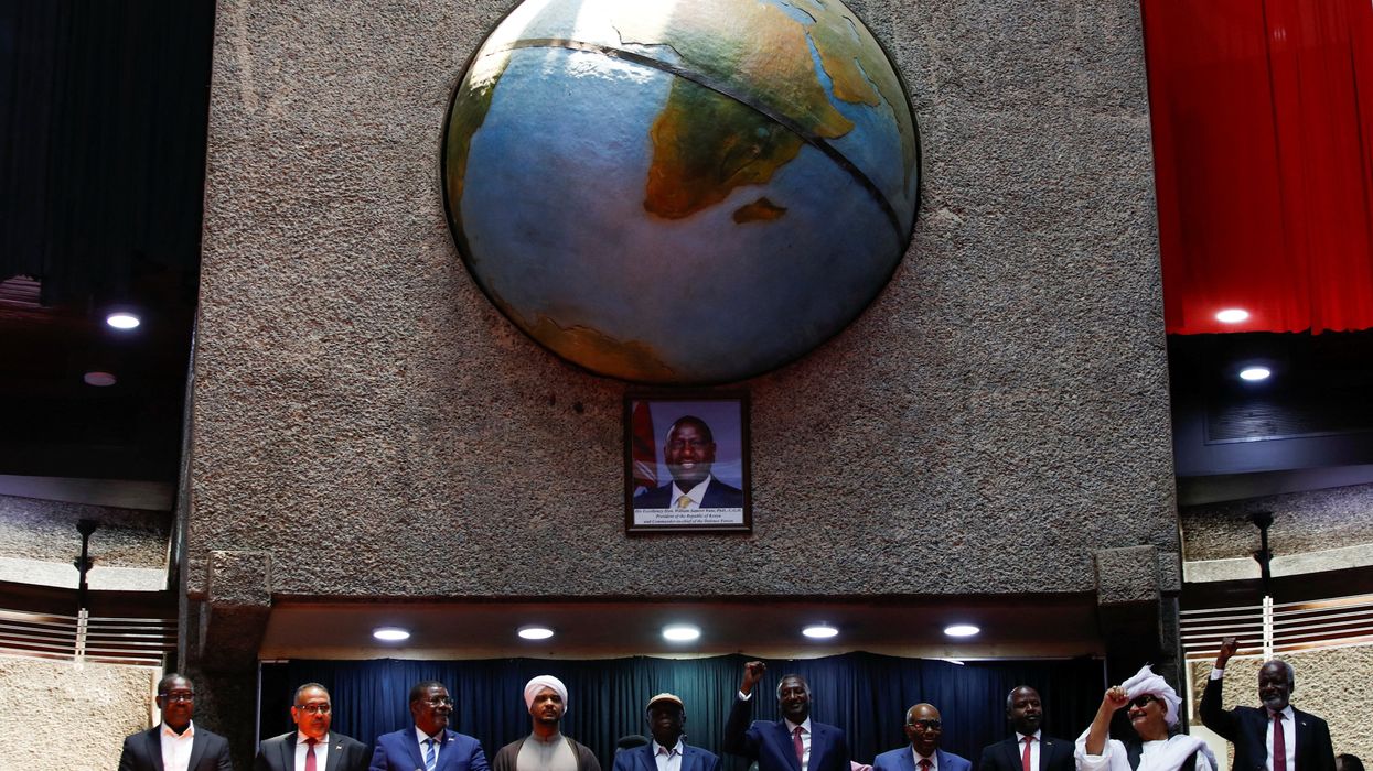Delegates affiliated to Sudan's Rapid Support Forces (RSF) react during a meeting for the planned signing, later postponed, of a political charter that would provide for a "Government of Peace and Unity" to govern the territories the force controls in Nairobi, Kenya, February 18, 2025.