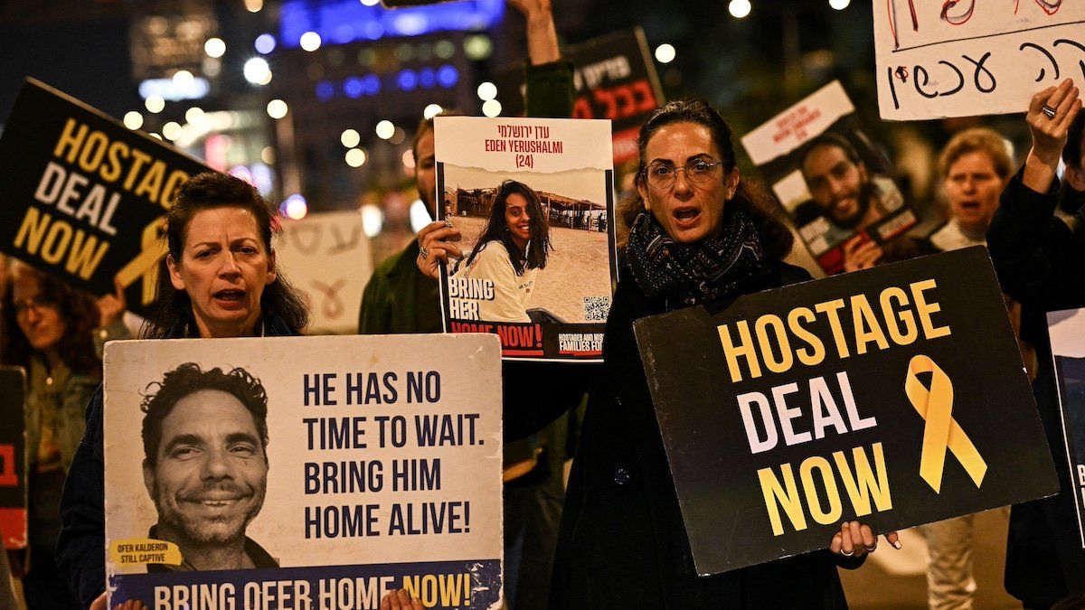 ​Demonstrators hold placards as they take part in a rally calling for the release of hostages kidnapped in the deadly October 7 attack on Israel by the Palestinian Islamist group Hamas from Gaza, in Tel Aviv, Israel, February 25, 2024. 