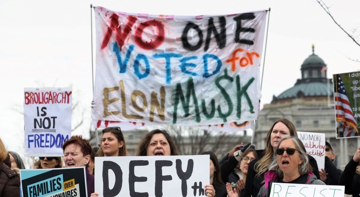 ​Demonstrators protest against U.S. President Donald Trump and Elon Musk outside the U.S. Capitol as Republicans prepare to vote on Trump's tax-cut agenda, in Washington, D.C., U.S., February 25, 2025. 