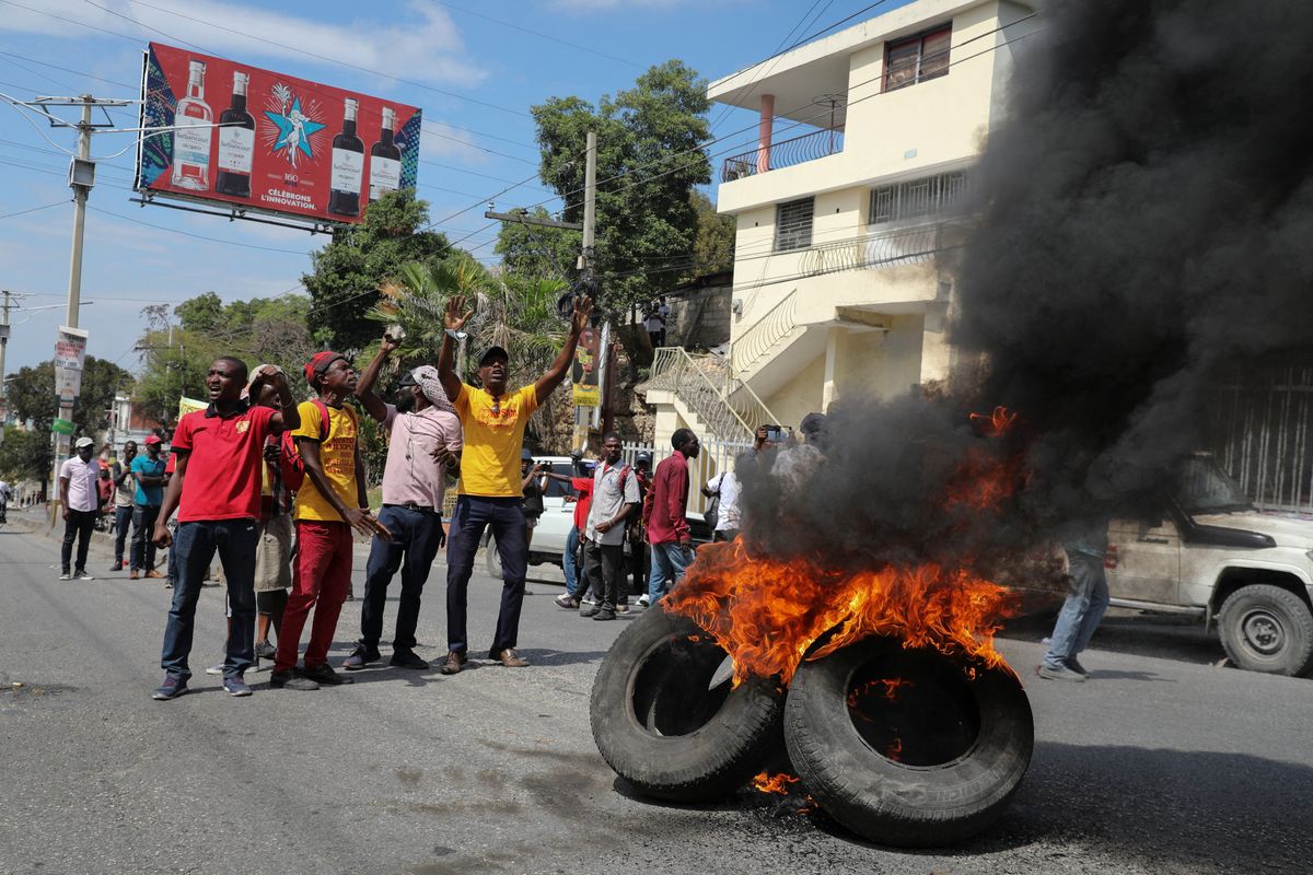 ​Demonstrators take part in a protest calling for the resignation of Haitian Prime Minister Ariel Henry outside the Canadian Embassy, in Port-au-Prince, Haiti February 25 2024. 