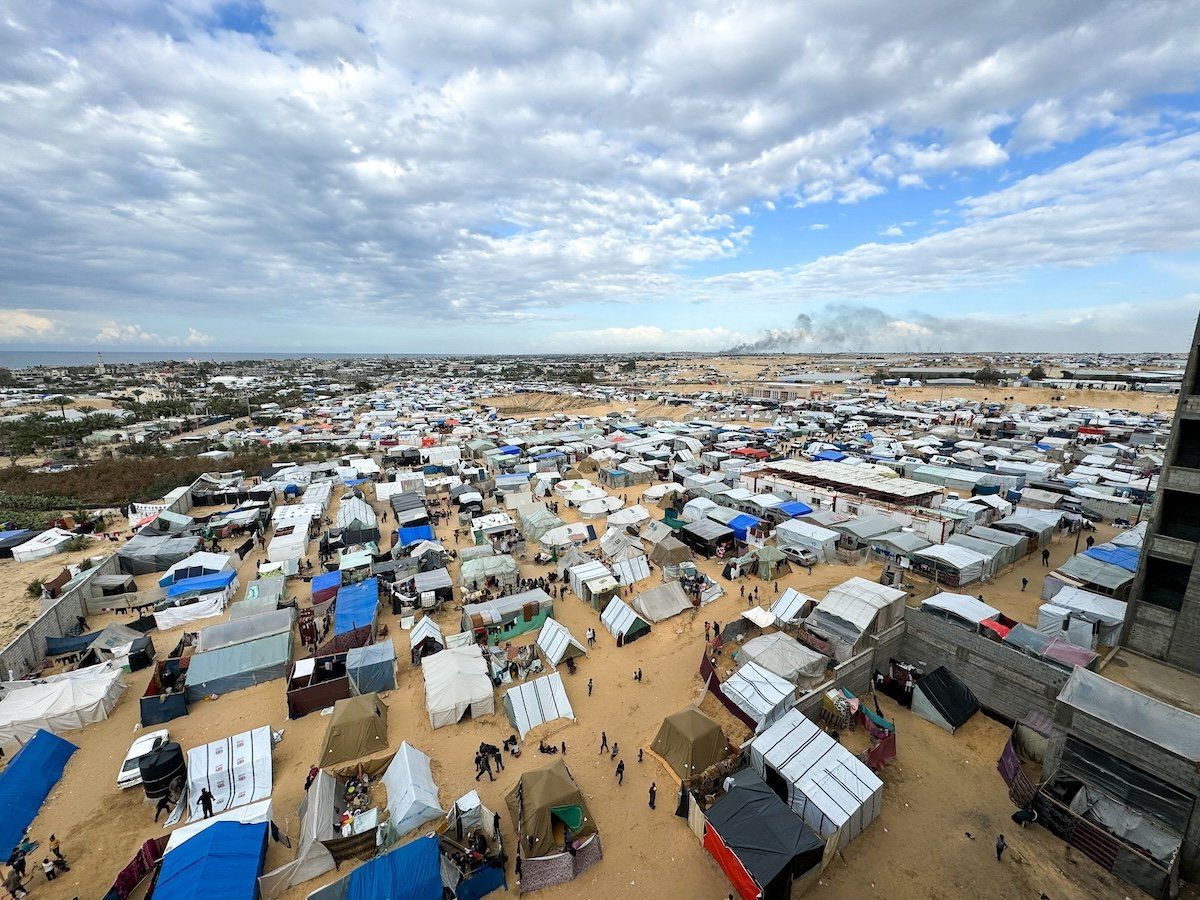 ​Displaced Palestinians take shelter in a tent camp in Rafah.