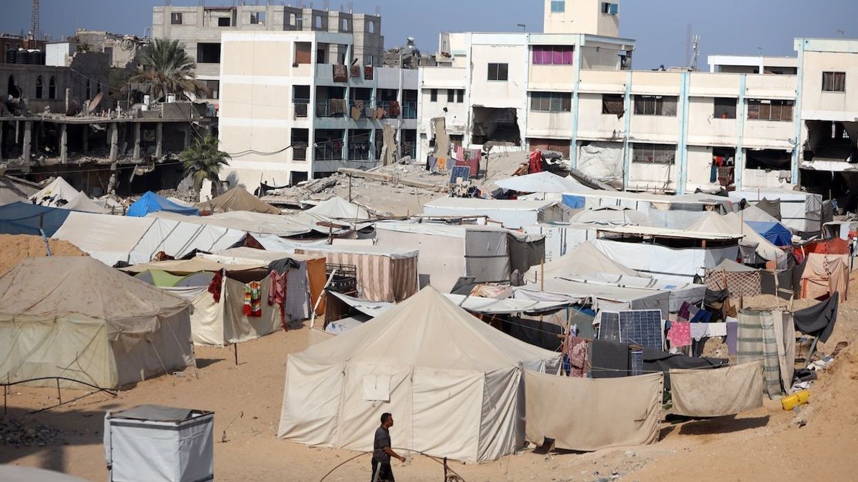 Displaced Palestinians walk in a tent camp amid the conflict between Israel and Hamas in Khan Younis, southern Gaza Strip, on Nov. 9, 2024.