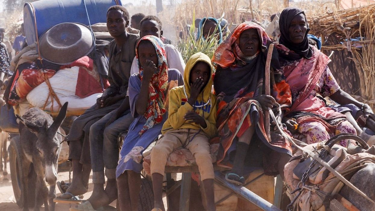 Displaced people ride an animal-drawn cart after Rapid Support Forces attacks on Zamzam displacement camp, in the town of Tawila, North Darfur, Sudan, on April 15, 2025.