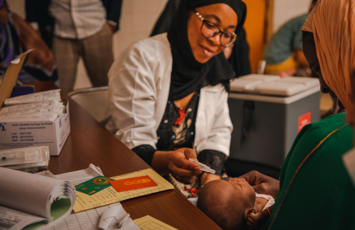 Doctor giving drops to an infant