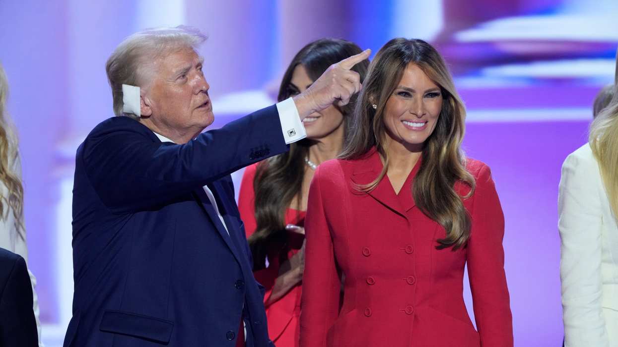Donald Trump and Melania Trump stand on stage at the conclusion of the final day of the Republican National Convention at the Fiserv Forum on July 18, 2024 in Milwaukee, WI.