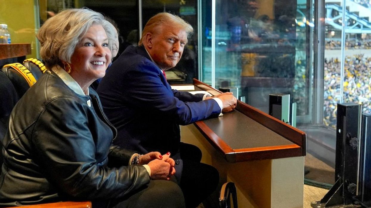 Donald Trump is seen here at a Jets football game next to his campaign manager Susie Wiles, on Oct. 20, 2024. The president-elect has just named Wiles his White House chief of staff.