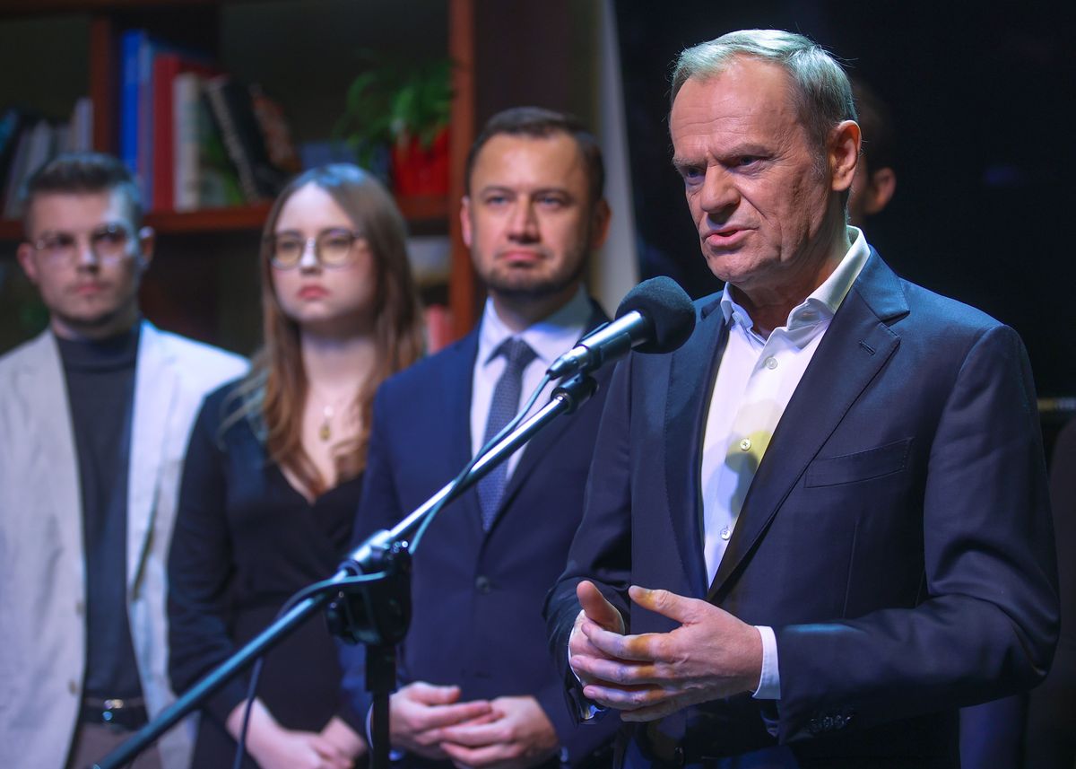 Donald Tusk, the chairman of the Civic Platform (PO) opposition party, surrounded by party members, speaks during a press conference in Krakow. 