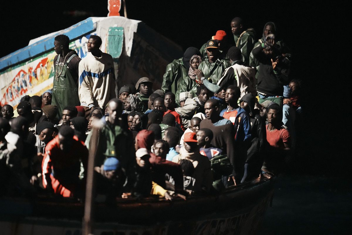 Dozens of people in a cayuco on their arrival at the dock of La Restinga, on November 4, 2023, in El Hierro, Canary Islands (Spain).