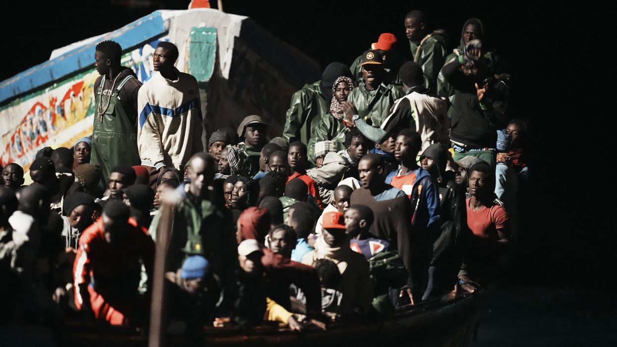 Dozens of people in a cayuco on their arrival at the dock of La Restinga, on November 4, 2023, in El Hierro, Canary Islands (Spain).