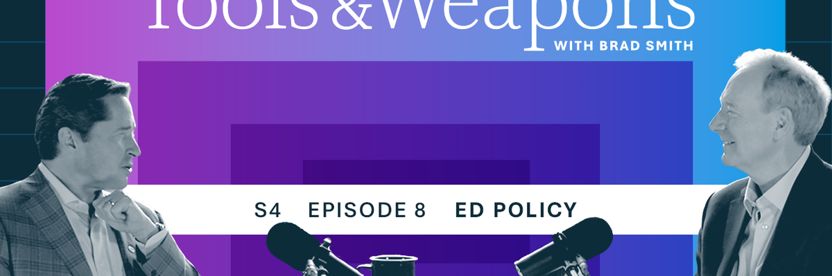 Ed Policy and Brad Smith seated at a table with microphones