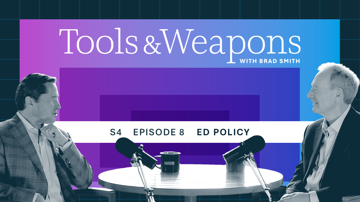 Ed Policy and Brad Smith seated at a table with microphones