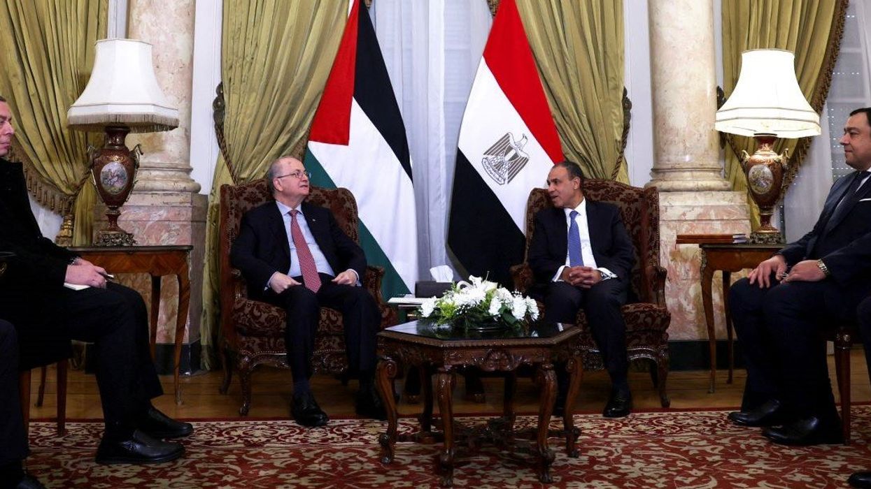 Egypt's Foreign Minister Badr Abdelatty meets with Palestinian Prime Minister Mohammad Mustafa at Al Tahrir palace in Cairo