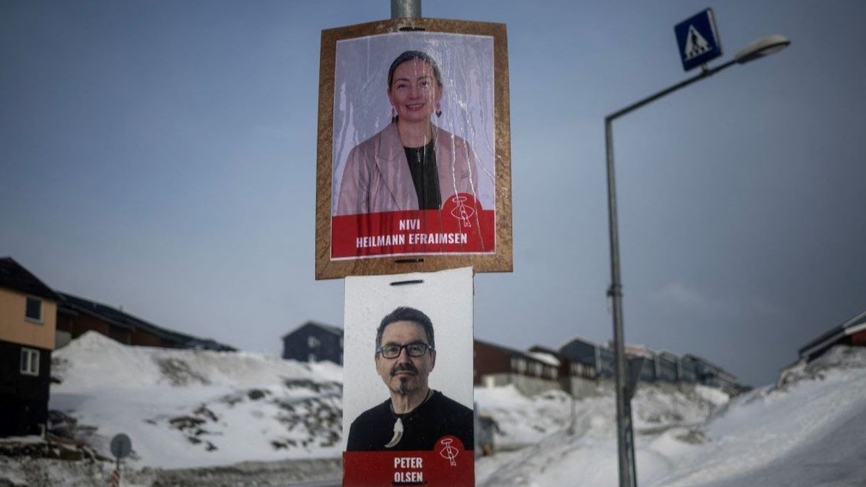 Election campaign posters are pictured on a street ahead of a March 11 general election in Nuuk, Greenland, March 9, 2025.