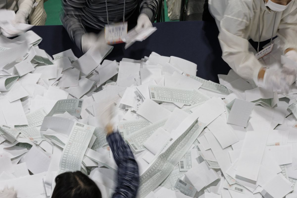 ​Election Commission officials count ballots for a parliamentary election at the gymnasium of Dongyang Mirae University in Guro-gu, Seoul, South Korea, April 10, 2024. 